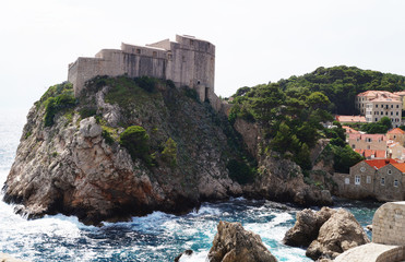 Fototapeta na wymiar Ancient fortress on ocean cliff