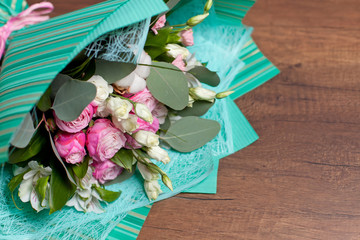 bouquet of flowers on a wooden background