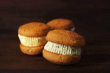 Ice cream cookie sandwiches on wooden background