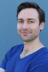 Fototapeta premium Joyful male smiling isolated close up