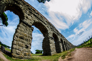 Fototapeta na wymiar A Roman aquaduct in the Rome countryside