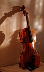 Old violin on the bed