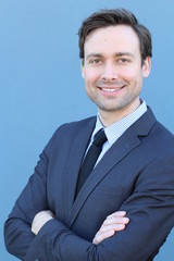 Young Businessman Smiling with Arms Crossed