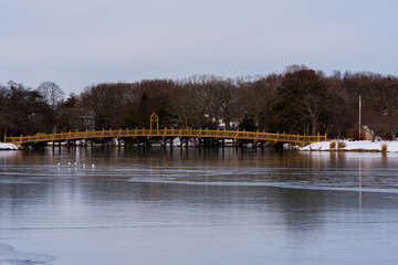 Fototapeta premium Bridge Over a Freezing Lake