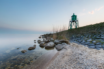 Fototapeta na wymiar Lighthouse with sunset background