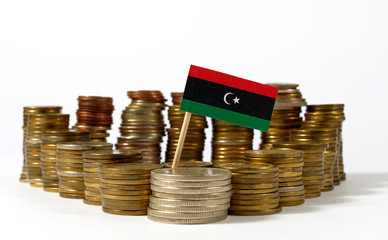 Libya flag waving with stack of money coins