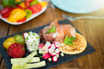 Focus on vegetable and parma ham preparation for appetizer