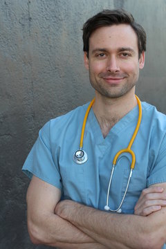 Doctor with stethoscope portrait isolated with arms crossed 