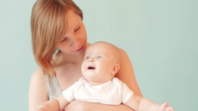 Smiling woman with her baby. Family concept.