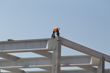 Construction worker on concrete truss