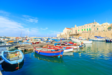 Fototapeta na wymiar Fishing boats in small port Giovinazzo near Bari, Apulia, Italy