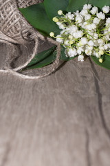 Lilly of the valley flowers on wooden table