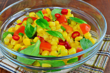 Fresh vegetable salad with corn, lamb's lettuce, chilly, sweet pepper and tomatoes