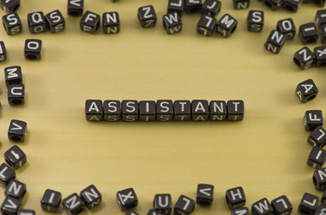 Word Assistant on a wooden background