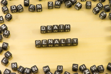 The word death penalty on wood background