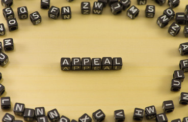 The word appeal on wood background