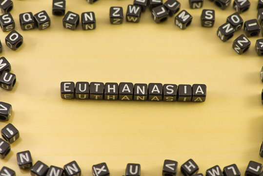 The word euthanasia on wood background