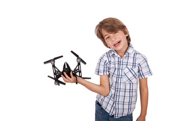 Cheerful boy playing with a drone.