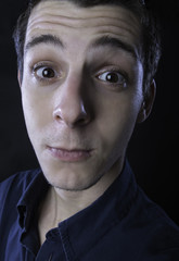 Obraz premium young man silly faces portrait