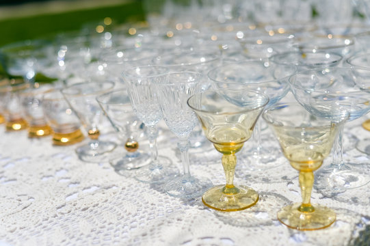 Closeup image of empty glasses for festive event on light background