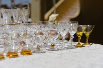 White table and row of glasses, celebration design set background