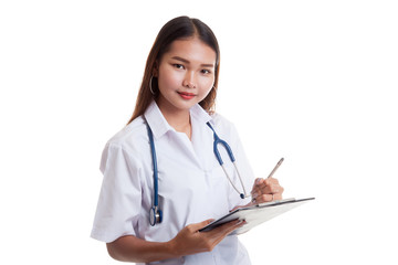 Asian young female doctor write on a clipboard.