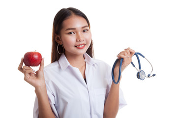 Young Asian female doctor hold  apple and stethoscope.