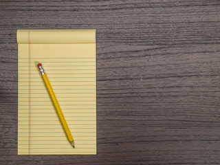 Dark Wood Desk, Yellow Pad, Pencil on Pad