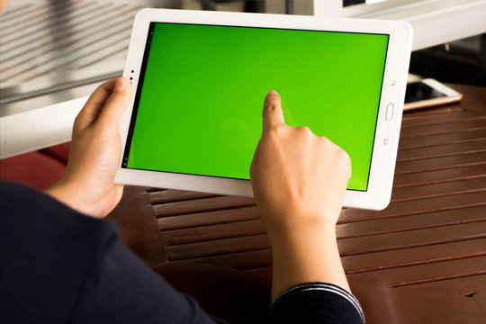 Women touch tablet green screen concept technology. 
