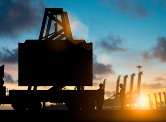 Silhouette inspector check the condition before shipping to customers over blurred natural background sunset pastel.Business Logistics and Transportation concept.flare light.