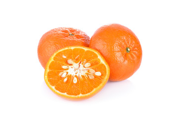 whole and half cut ripe mandarin orange on white background