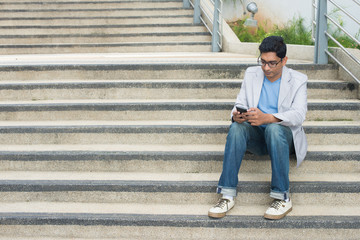 Obraz na płótnie Canvas indian business male with a tablet computer