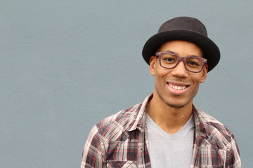 Mixed ethnicitiy man wearing hat and glasses portrait