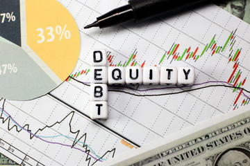 Debt and equity letter cube on white candle stick chart background. conceptual image for D/E ratio in stock investment.