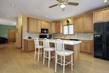 Kitchen with white counter island