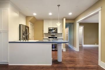 Kitchen with blue island counter