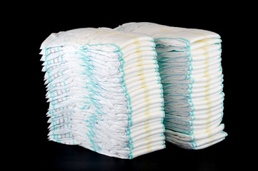 stacking diapers isolated on black background