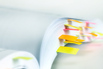 Fototapeta premium Close up White book marked by sticky note