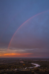 Rainbow over city