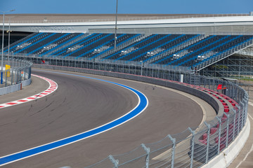 Motor racing track. Turning asphalt road with marking lines