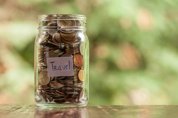 Jar of full coins in concept money saving