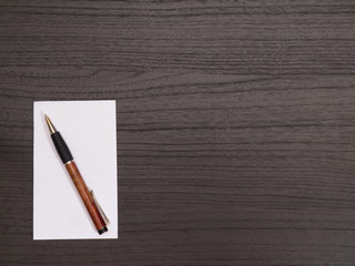 Wood Desktop, White Notepad, Pen