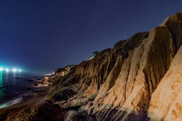 Fototapeta na wymiar Night skies and stars over the cliffs at El Matador state Beach near Malibu California