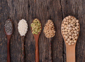 Fototapeta na wymiar Cereal grains , seeds, beans on wooden background