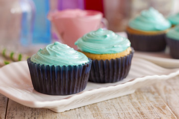 Vanilla cupcakes with mint cream