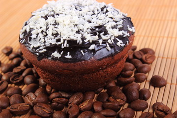 Chocolate muffins with desiccated coconut and coffee grains