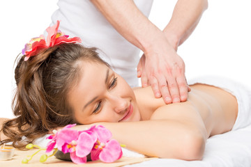Obraz na płótnie Canvas Serene woman enjoying a massage or skin treatment in the spa