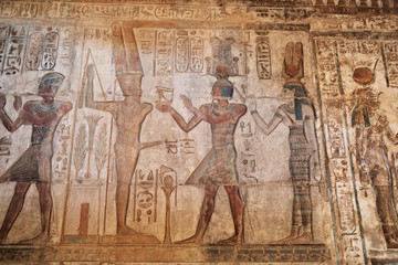 Fototapeta na wymiar Hieroglyphic carvings and paintings on the interior walls of the temple 
