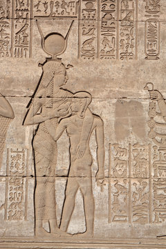 Hieroglyphic carvings and paintings on the interior walls of the temple 