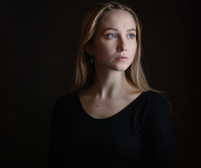 Portrait of a beautiful young woman with blue eyes.